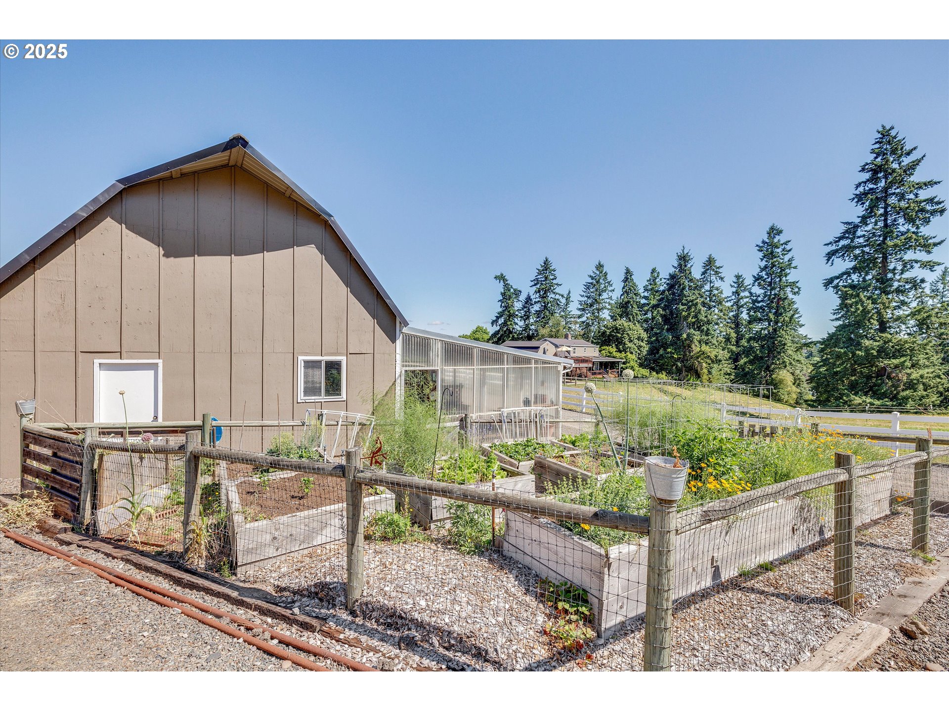 11800 South Carus Road Canby, OR 97013 - Photo 32 of 45 a backyard of a house with table and chairs