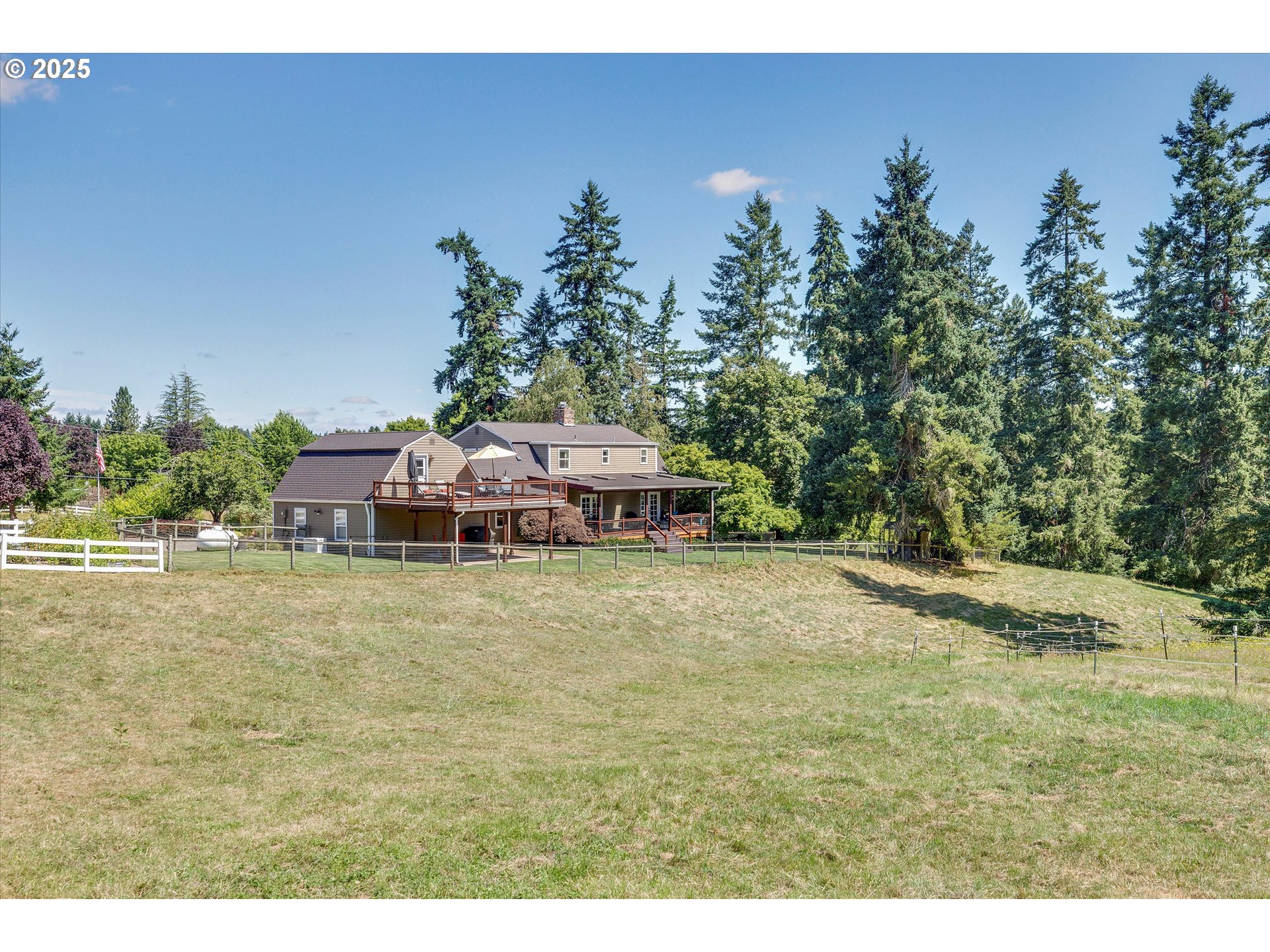 11800 South Carus Road Canby, OR 97013 - Photo 44 of 45 a backyard of a house with a yard and outdoor seating