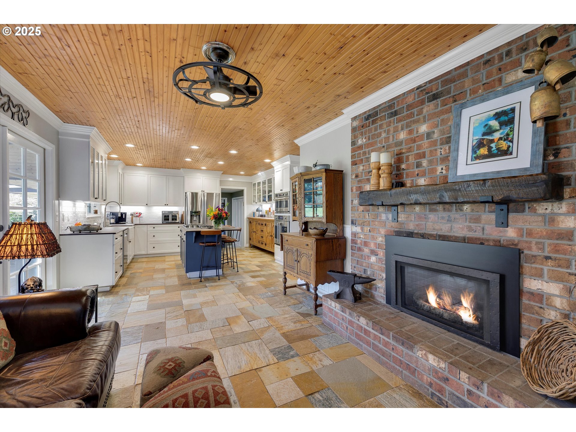 11800 South Carus Road Canby, OR 97013 - Photo 10 of 45 a living room with furniture and a fireplace