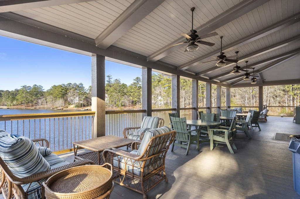 72 Buckeye Ridge Newnan, GA 30263 - Photo 70 of 80 a view of a patio with chairs and floor to ceiling window