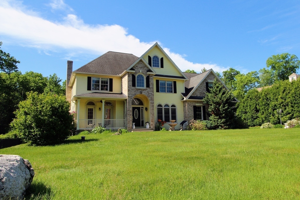 5 Gableview Lane Southwick, MA 01077 - Photo 5 of 41 a front view of a house with a yard