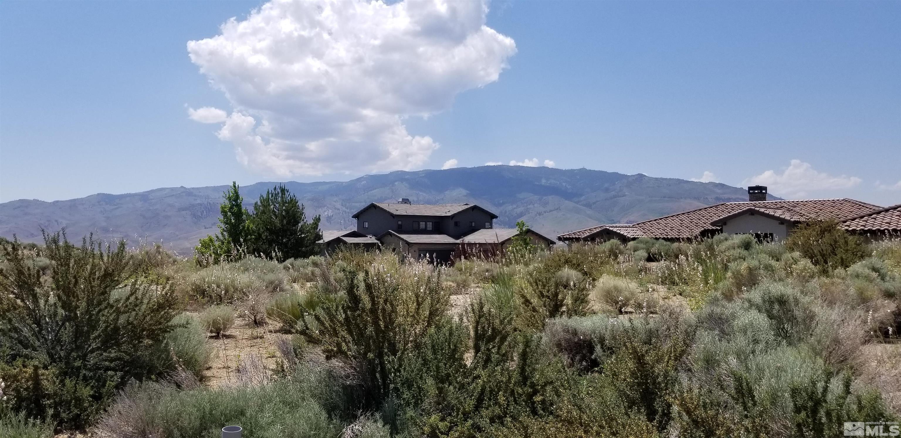 2275 Eagle Bend Court Reno, NV 89523 - Photo 8 of 9 a view of a lush green hillside and a building