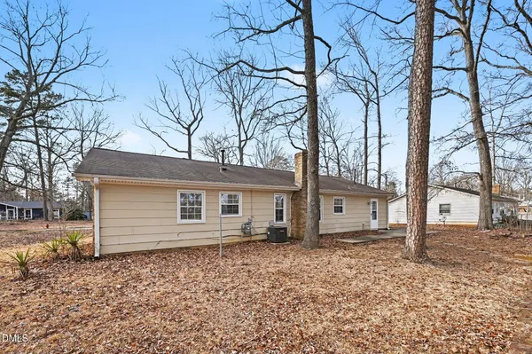 a house that has a tree in front of the house