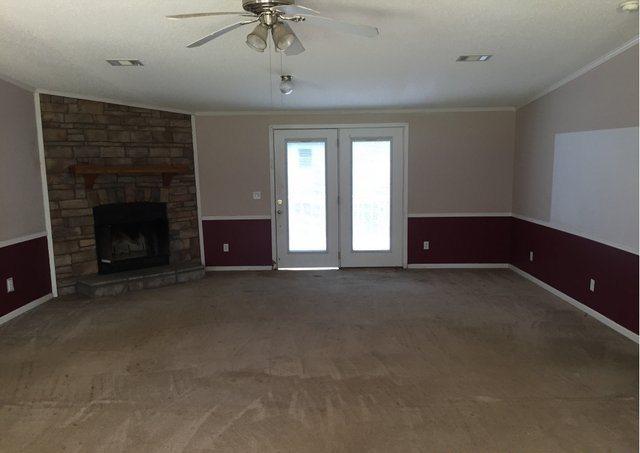 1054 Reeves Road Baker, FL 32531 - Photo 3 of 14 a living room with furniture and a fireplace