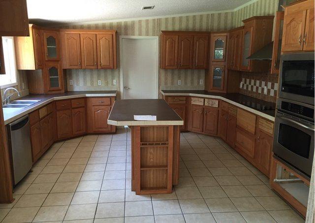 1054 Reeves Road Baker, FL 32531 - Photo 6 of 14 a kitchen with a cabinets and counter space