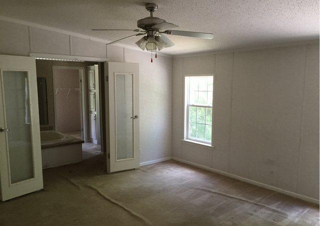 1054 Reeves Road Baker, FL 32531 - Photo 7 of 14 a view of an empty room with a window