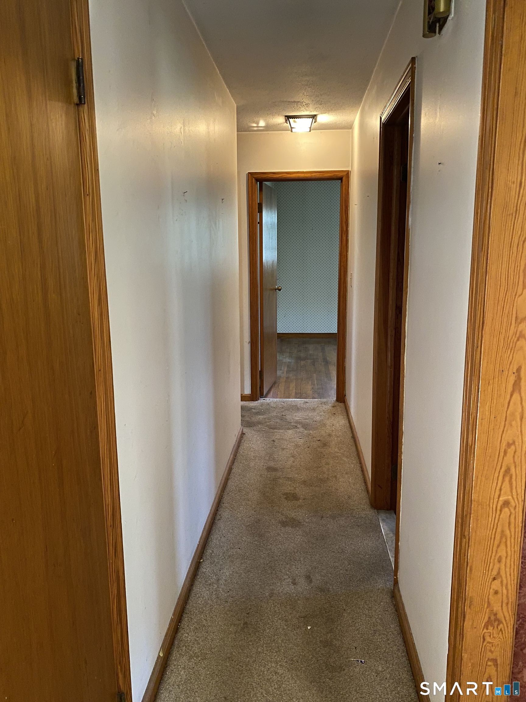 268 Bell Street Middletown, CT 06457 - Photo 11 of 36 a view of a hallway with wooden shelves