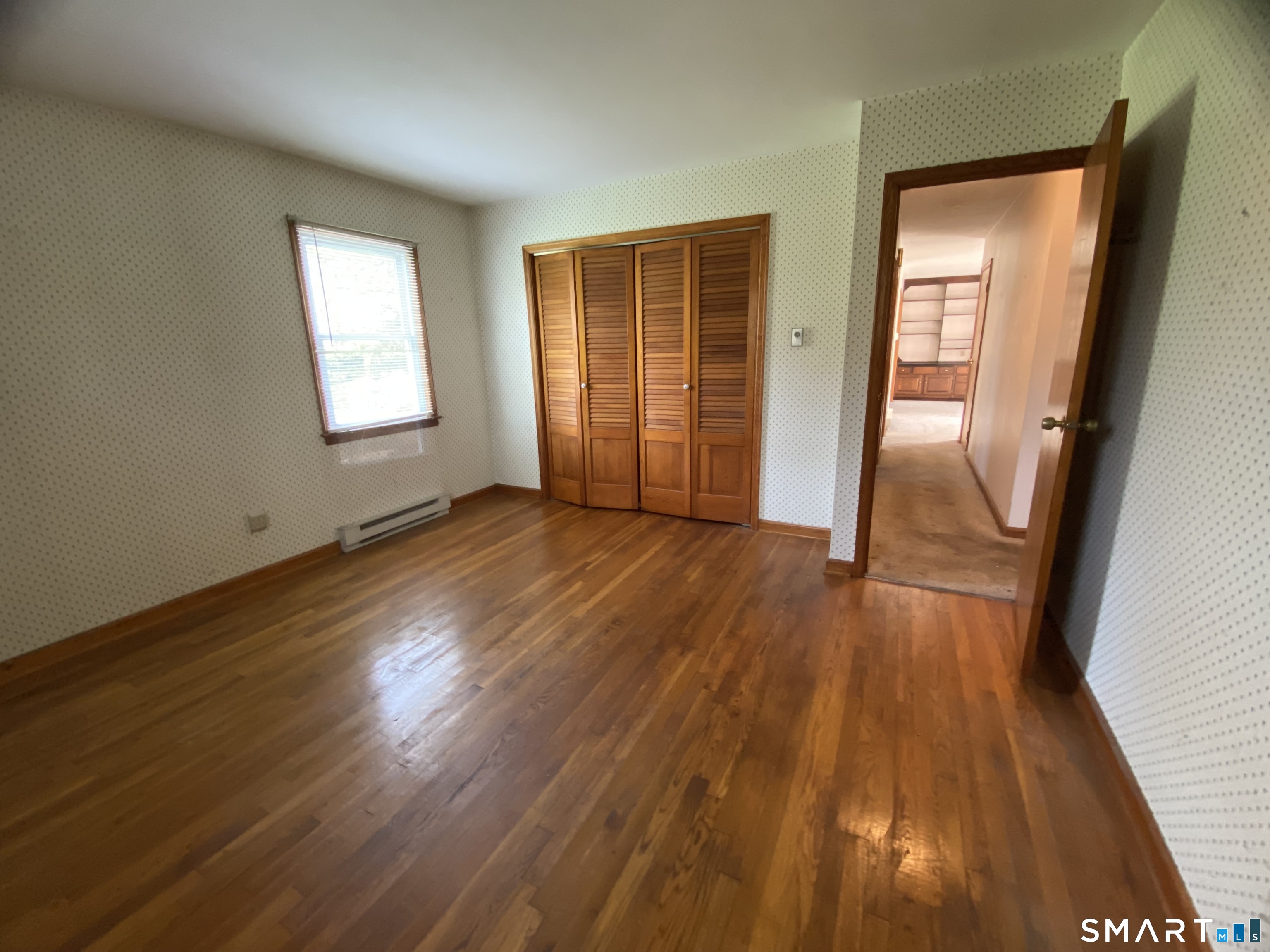 268 Bell Street Middletown, CT 06457 - Photo 13 of 36 an empty room with wooden floor and a window