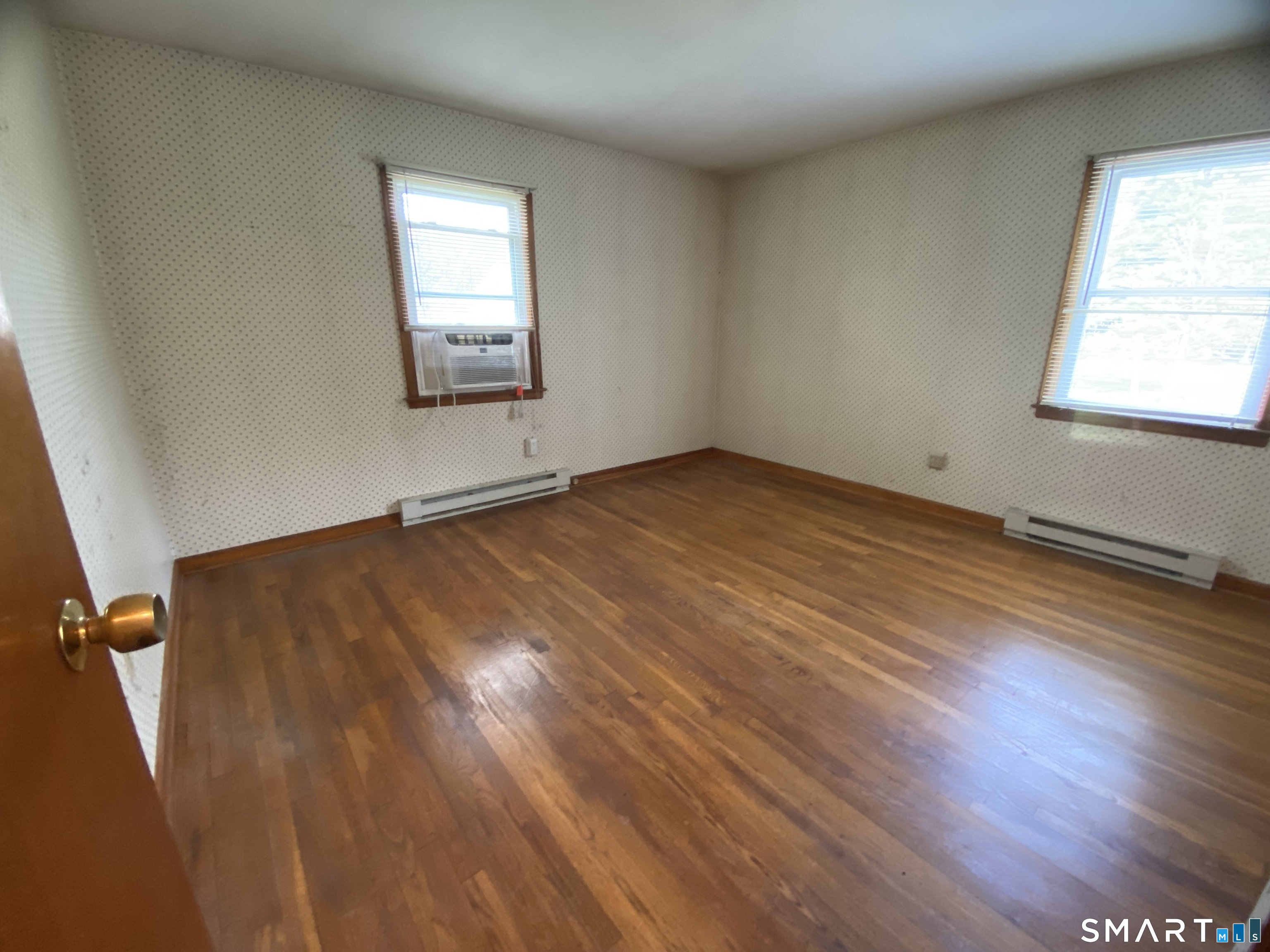 268 Bell Street Middletown, CT 06457 - Photo 14 of 36 wooden floor in an empty room with a window