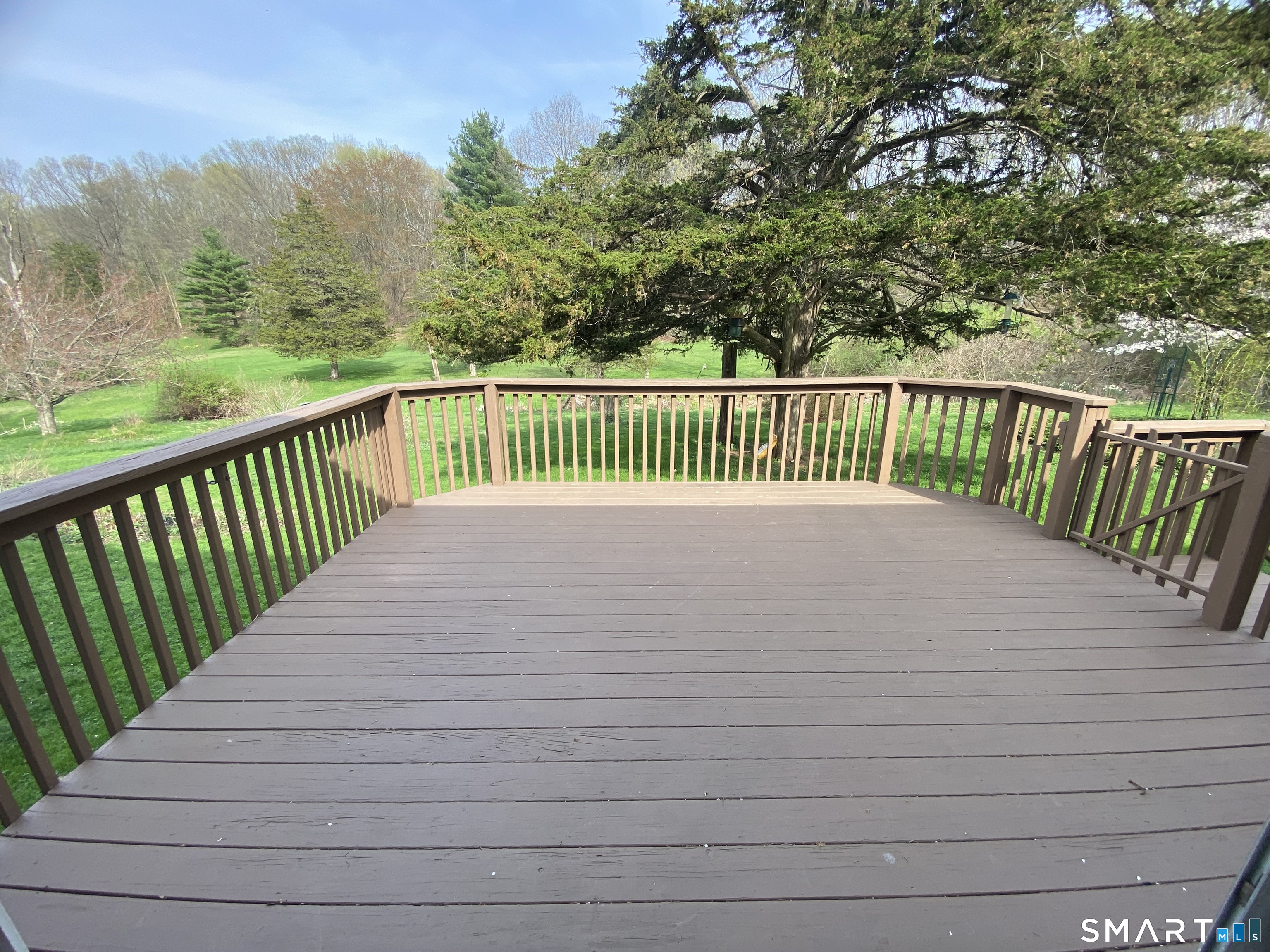 268 Bell Street Middletown, CT 06457 - Photo 8 of 36 a balcony with trees in the background
