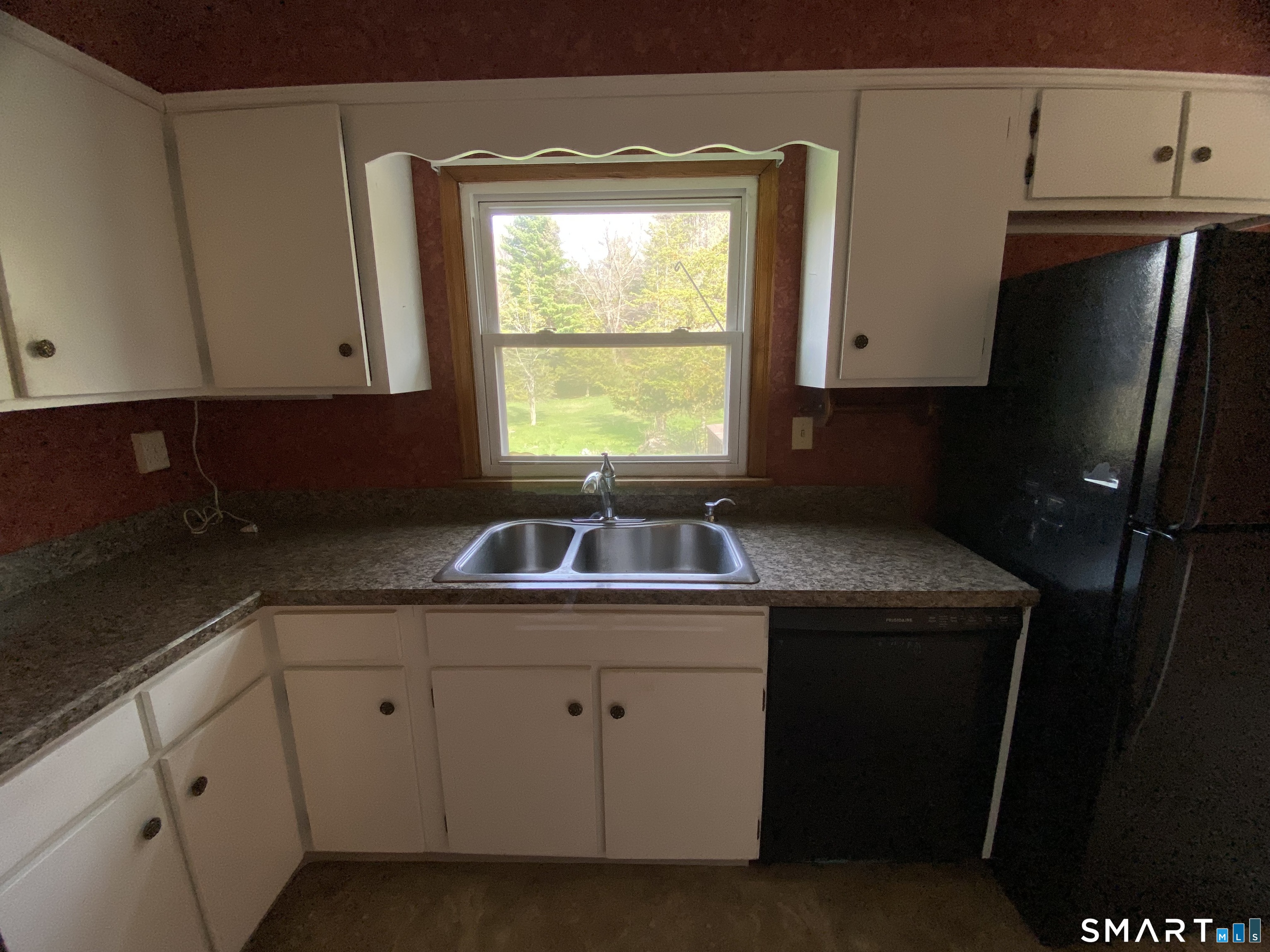 268 Bell Street Middletown, CT 06457 - Photo 9 of 36 a kitchen with a sink window and cabinets