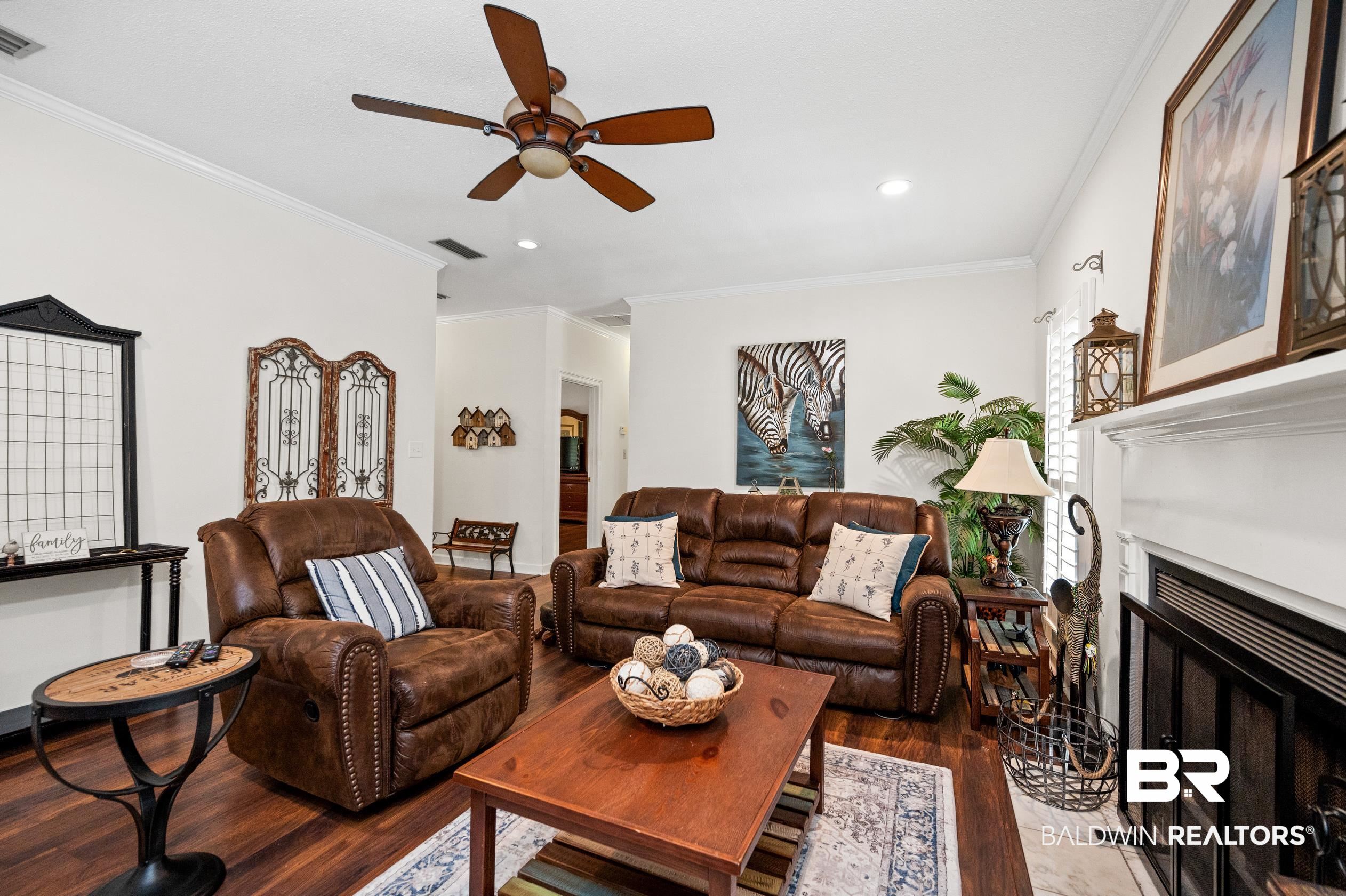 6638 Jackson Square Daphne, AL 36526 - Photo 13 of 62 Living room featuring ceiling fan, dark hardwood / wood-style flooring, and ornamental molding