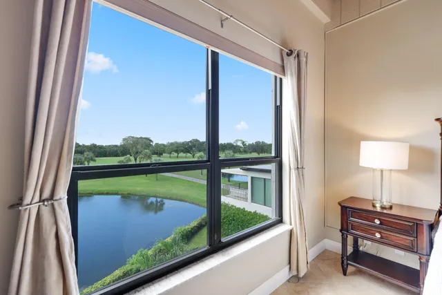 a view of a balcony next to a yard