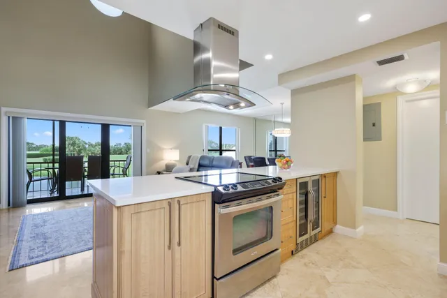 a kitchen with a stove and a sink