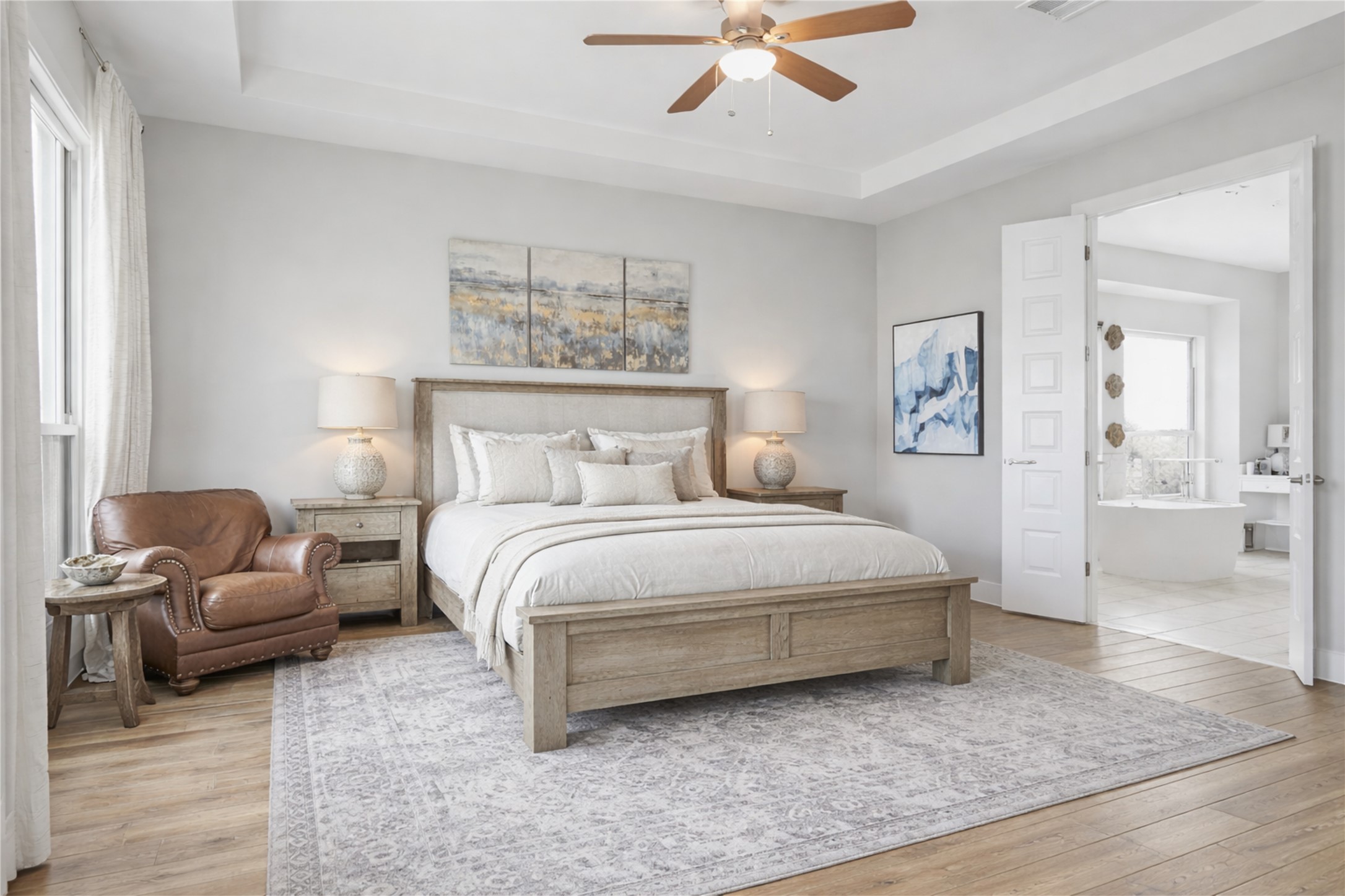 2009 Nature View Loop Driftwood, TX 78619 - Photo 14 of 37 a bedroom with a bed and a chandelier