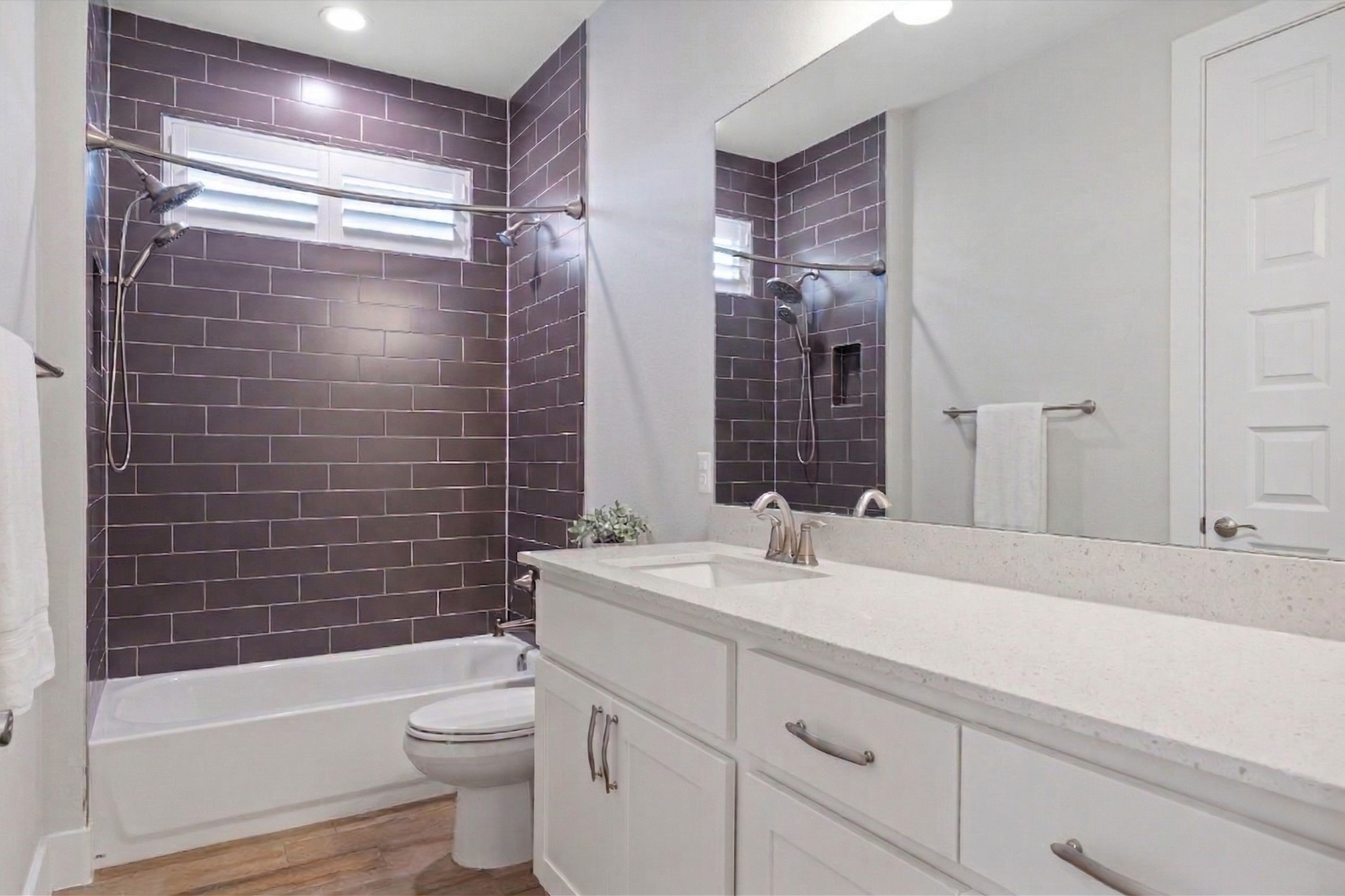 2009 Nature View Loop Driftwood, TX 78619 - Photo 24 of 37 a bathroom with a bathtub shower sink vanity mirror and toilet