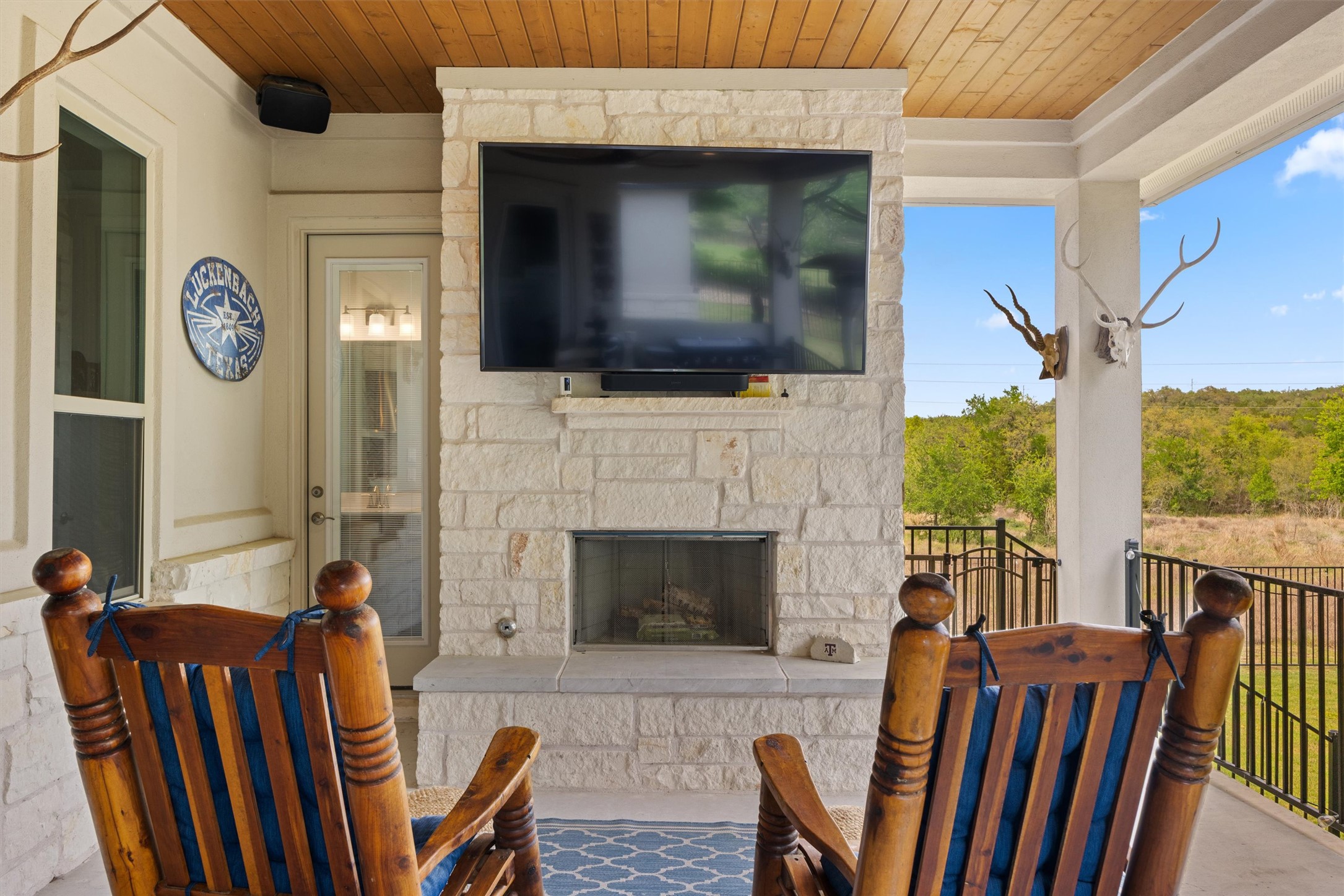 2009 Nature View Loop Driftwood, TX 78619 - Photo 26 of 37 a living room with furniture fireplace and flat screen tv
