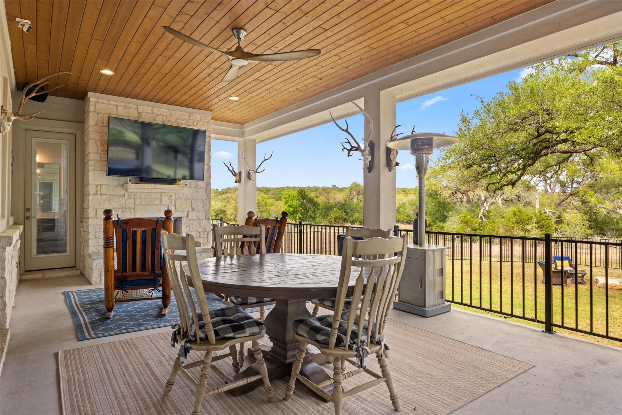 2009 Nature View Loop Driftwood, TX 78619 - Photo 28 of 37 a view of an outside dining space with furniture