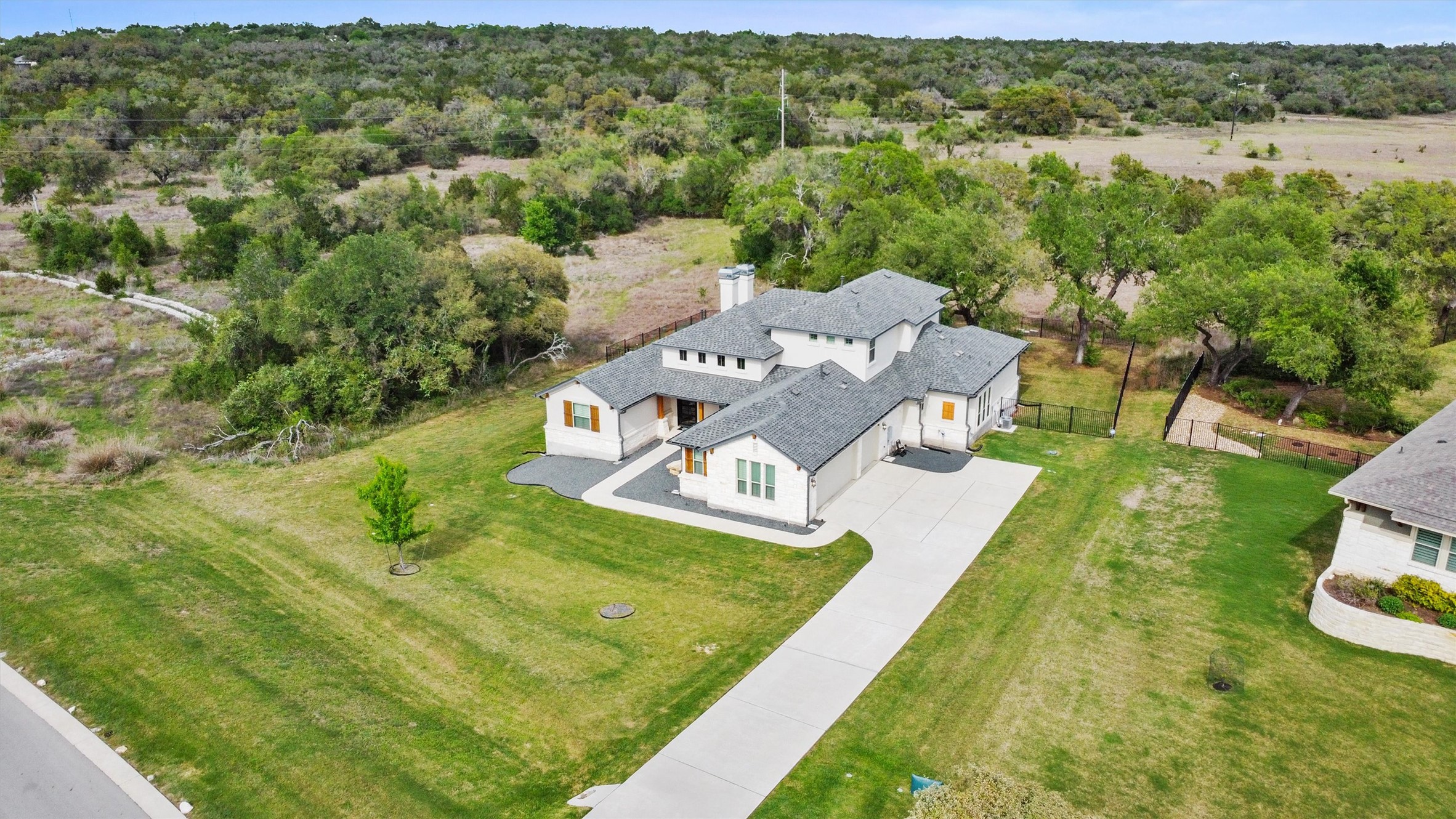 2009 Nature View Loop Driftwood, TX 78619 - Photo 30 of 37 an aerial view of a house with a yard
