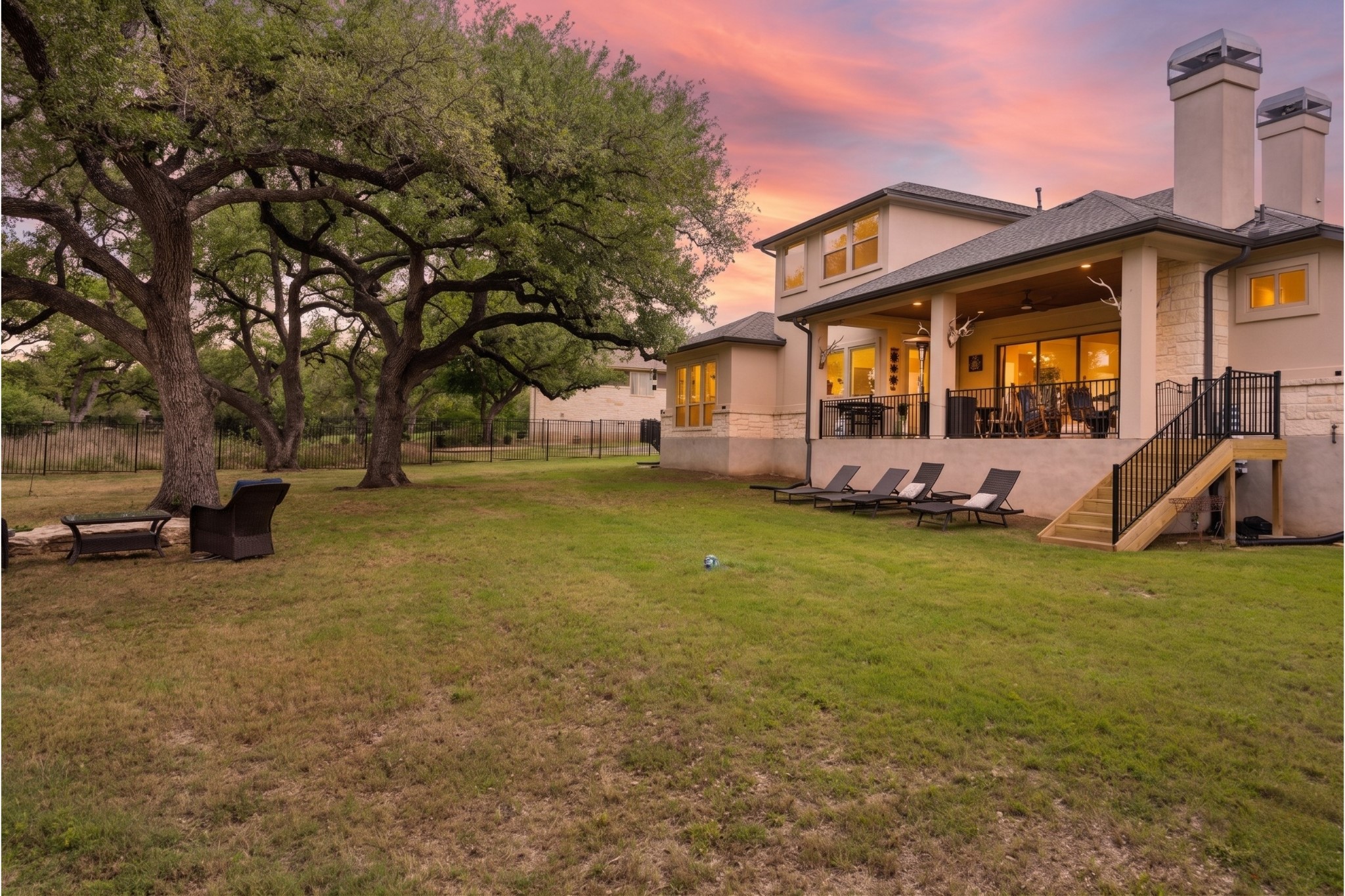 2009 Nature View Loop Driftwood, TX 78619 - Photo 31 of 37 SPACIOUS BACKYARD WITH OPEN GREENSPACE, MATURE TREES, AND A COVERED DECK PERFECT FOR OUTDOOR RELAXATION OR ENTERTAINING.