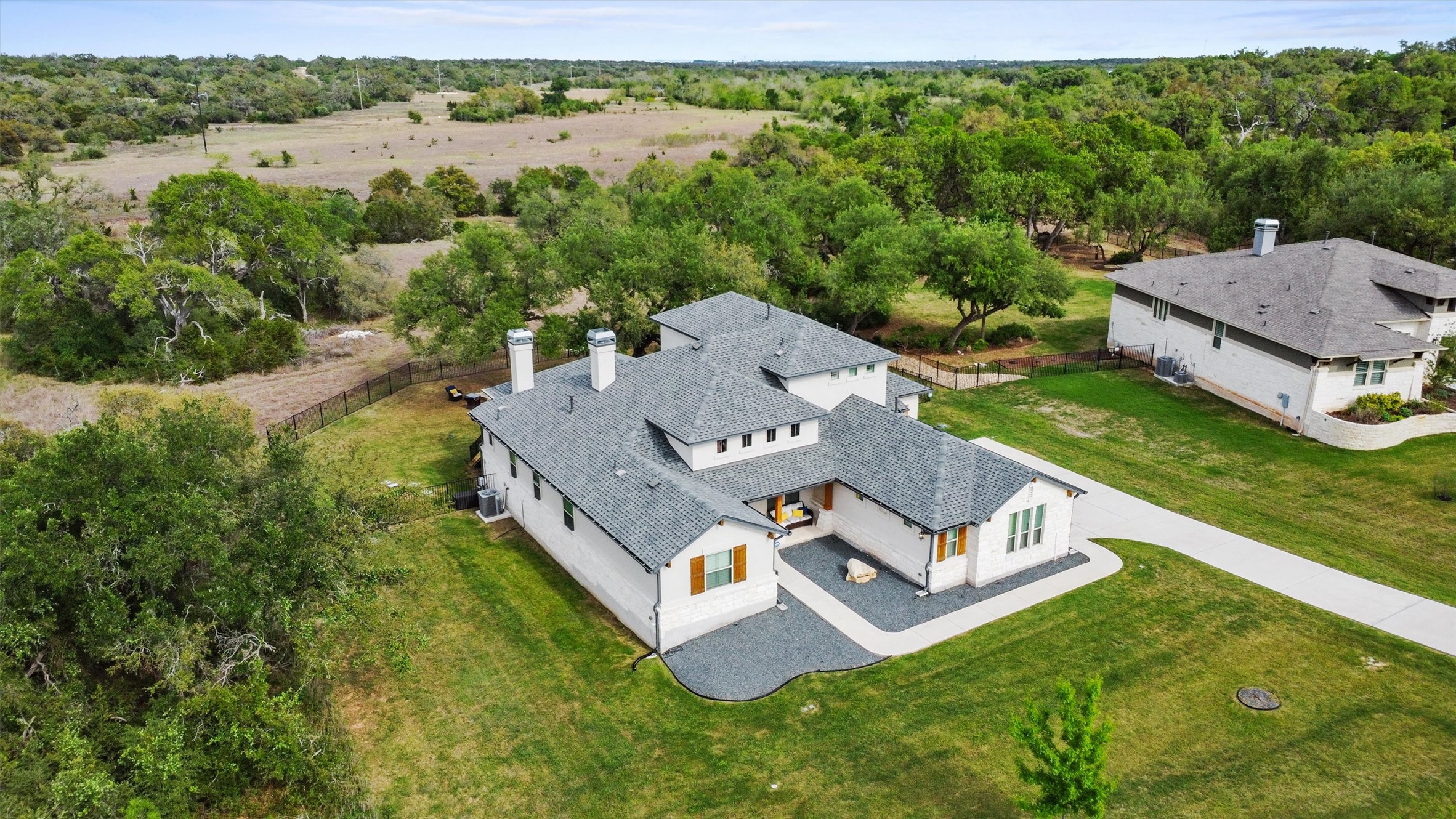 2009 Nature View Loop Driftwood, TX 78619 - Photo 32 of 37 an aerial view of a house with a big yard
