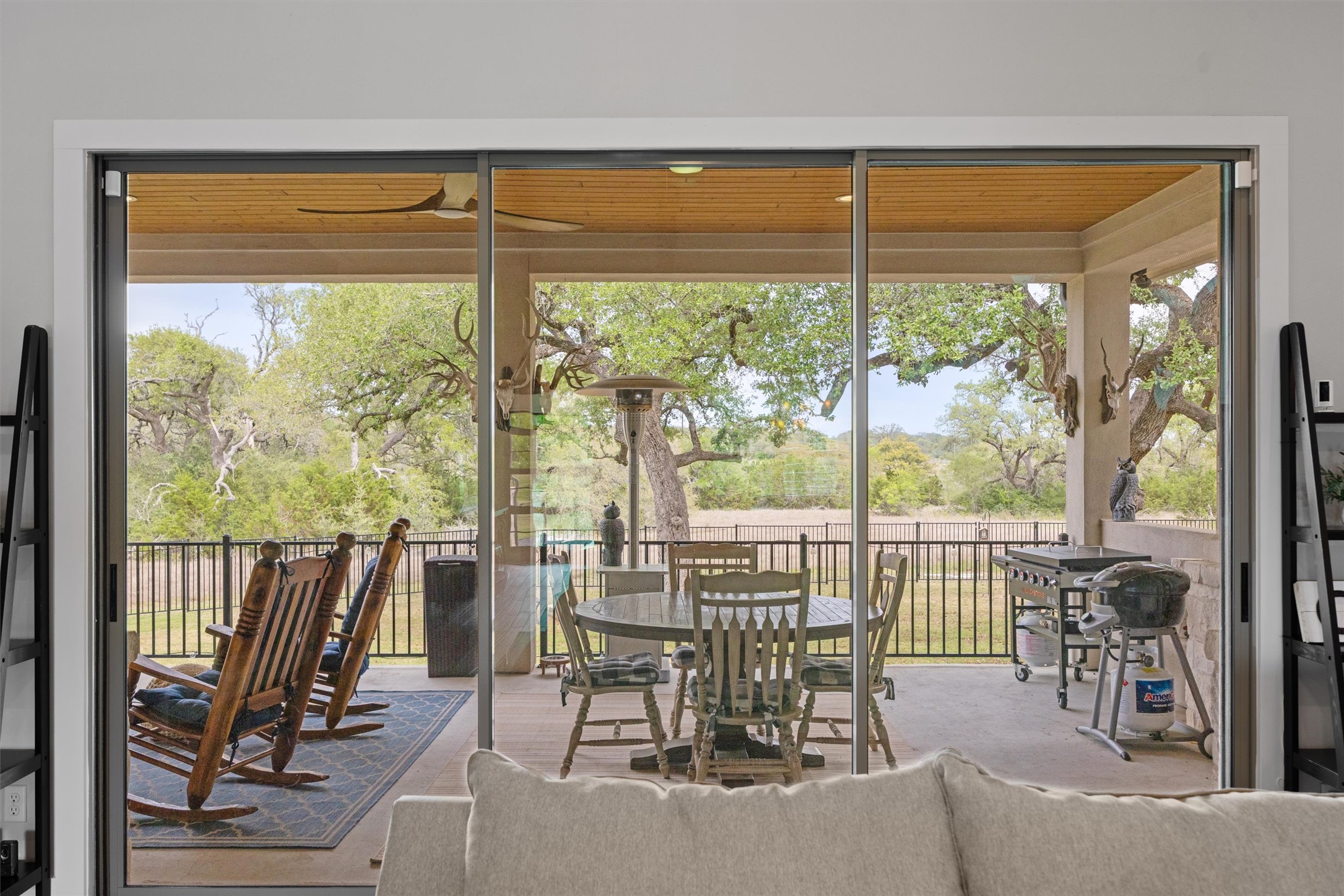 2009 Nature View Loop Driftwood, TX 78619 - Photo 6 of 37 a view of a room with a furniture and floor to ceiling window