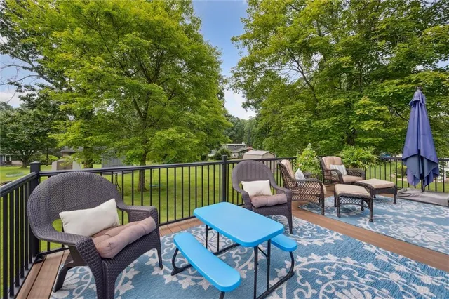a view of a chairs and table in patio