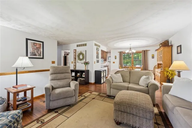 a living room with furniture and a lamp
