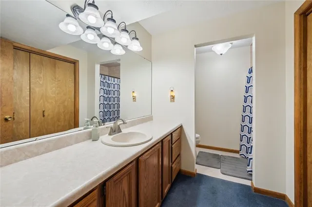 a bathroom with a sink a vanity and a mirror