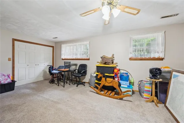 a view of a room with furniture window and a chandelier