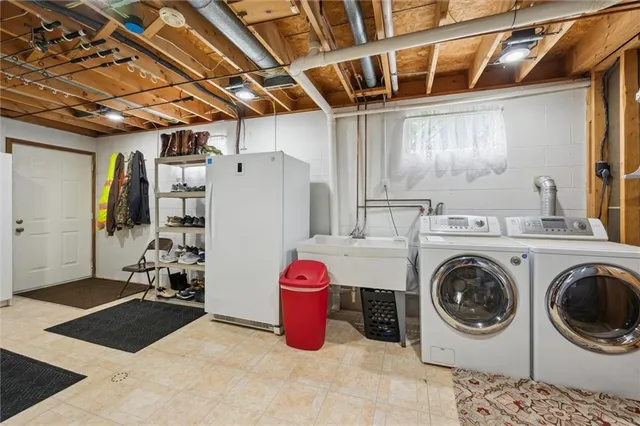 a utility room with dryer and washer