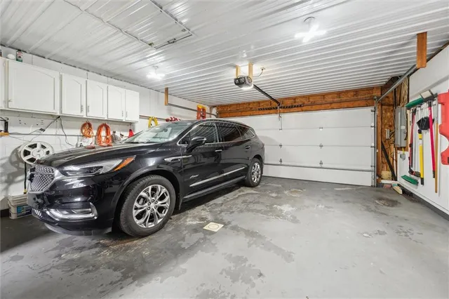 a view of parking garage with cars