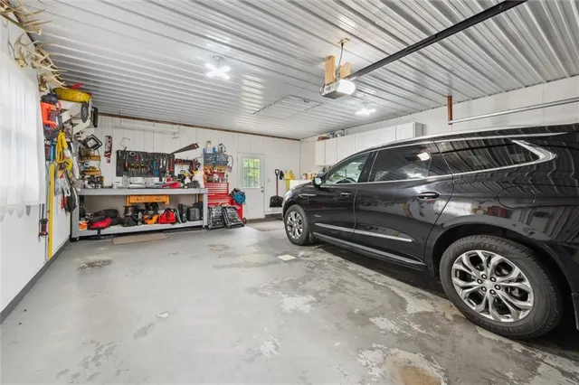 a view of a house with a yard and sitting area