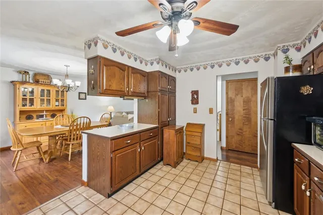 a kitchen with stainless steel appliances granite countertop a sink and cabinets