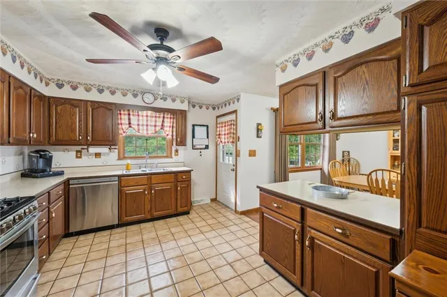 a kitchen with a sink cabinets and window