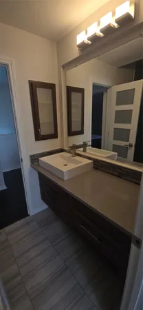 a room with wooden floor and window