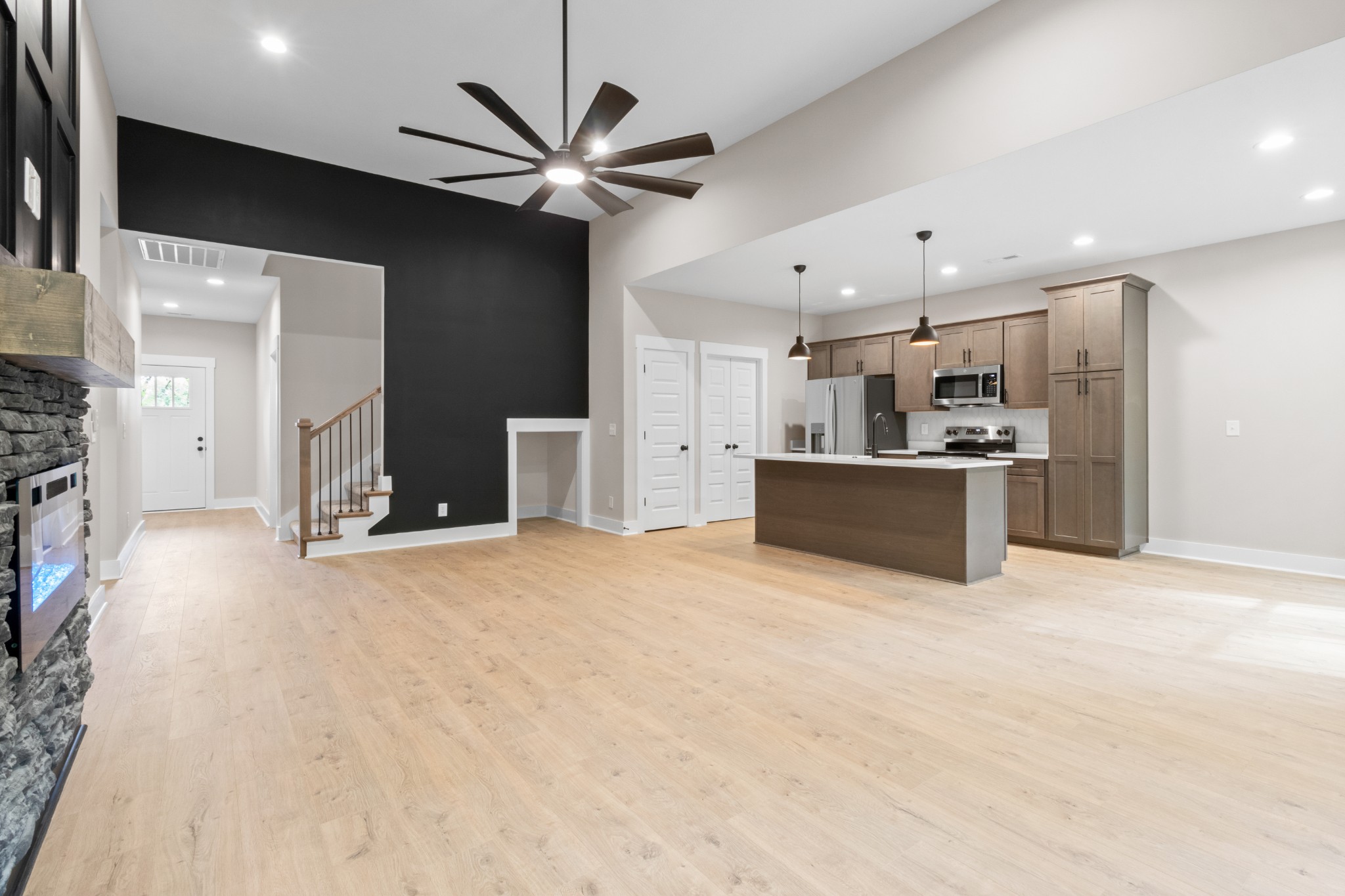 380 Durham Road Clarksville, TN 37043 - Photo 8 of 44 a view of a kitchen with a stove cabinets and a ceiling fan