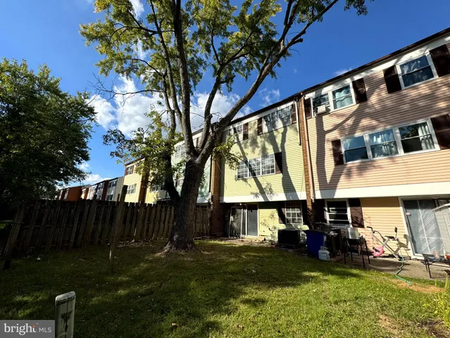 a view of house with backyard