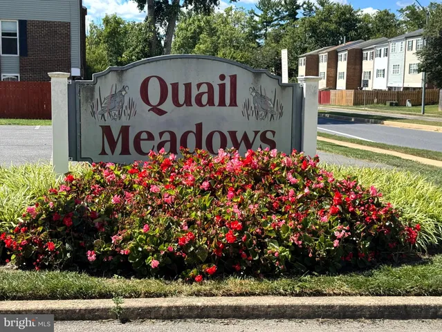 a view of a sign board with a street sign