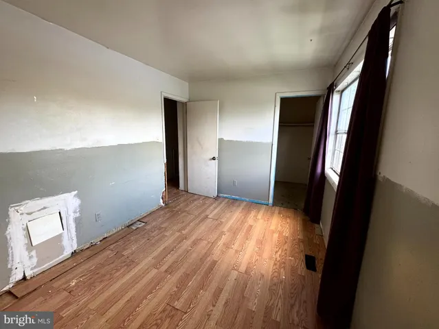 a view of hallway with wooden floor