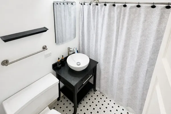 a bathroom with a sink toilet and tub