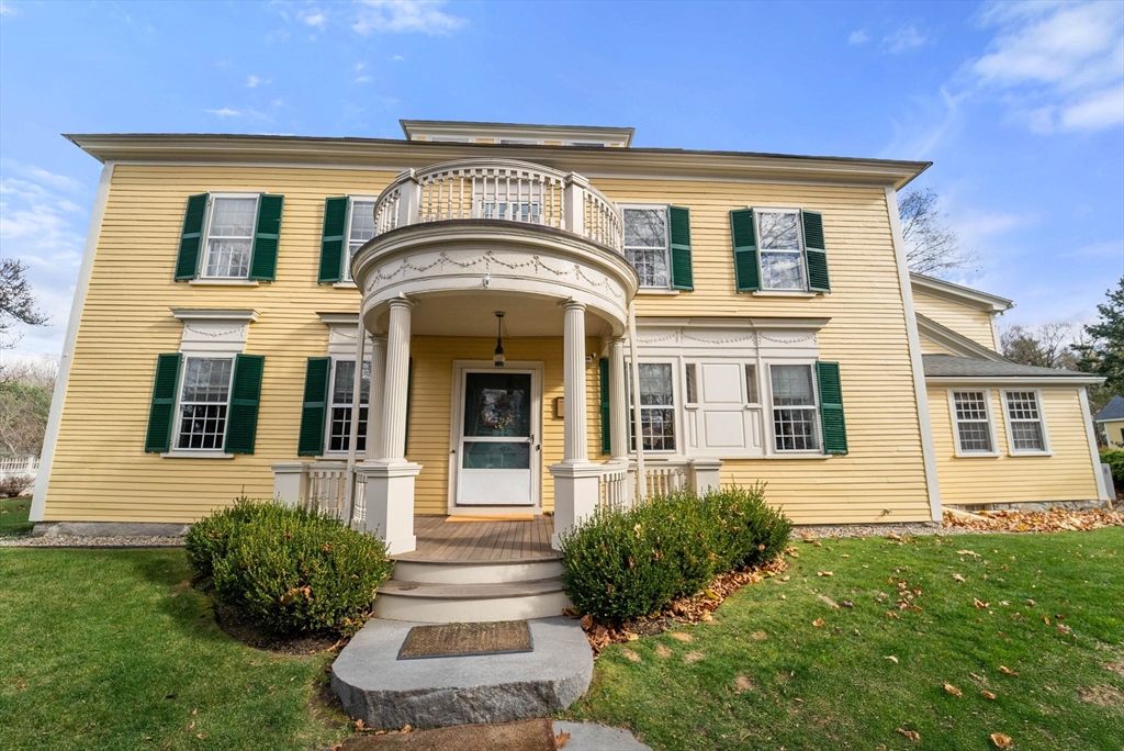 221 Boston Post Road Wayland, MA 01778 - Photo 1 of 37 a front view of a house with a garden