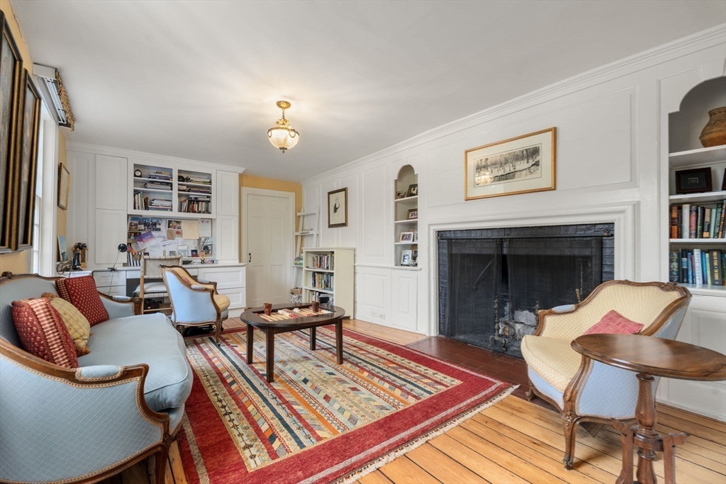 221 Boston Post Road Wayland, MA 01778 - Photo 16 of 37 a living room with furniture and a fireplace