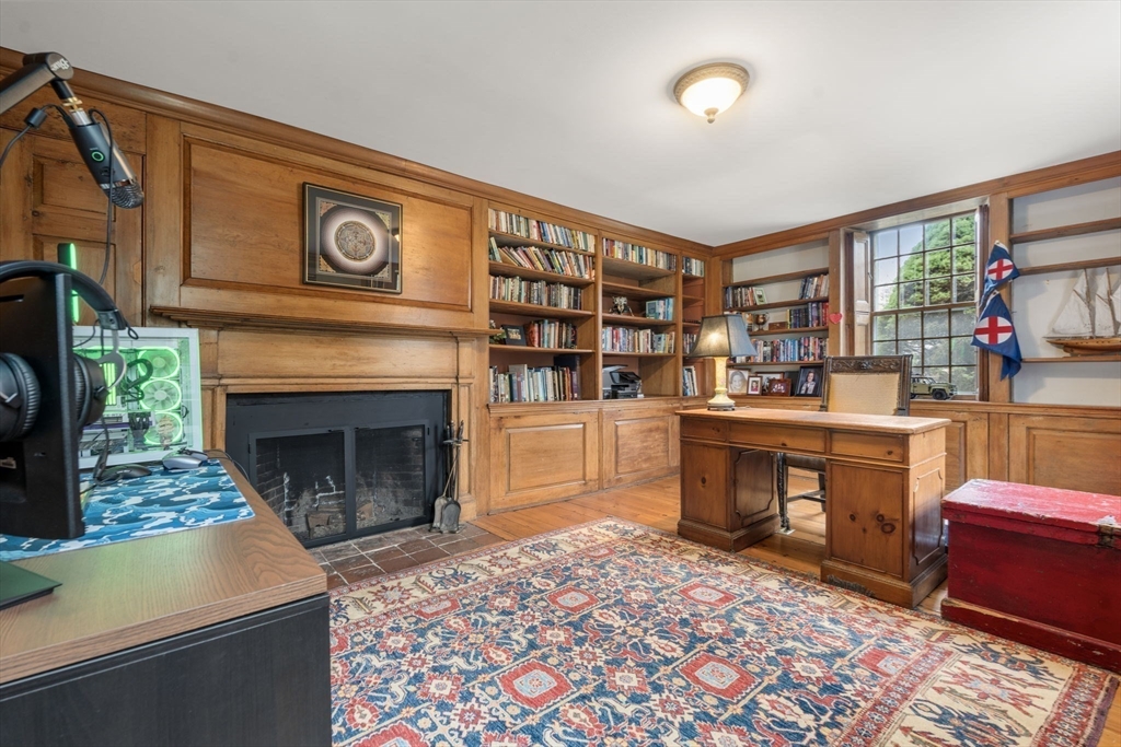 221 Boston Post Road Wayland, MA 01778 - Photo 17 of 37 a living room with furniture and a fireplace