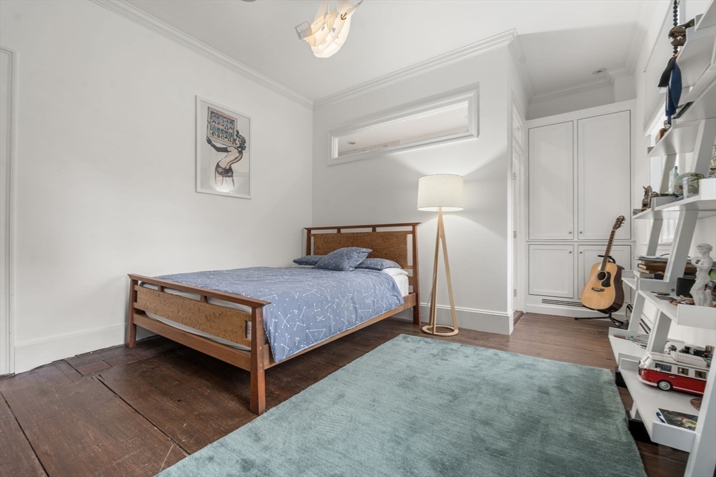 221 Boston Post Road Wayland, MA 01778 - Photo 23 of 37 a bedroom with a bed and a mirror
