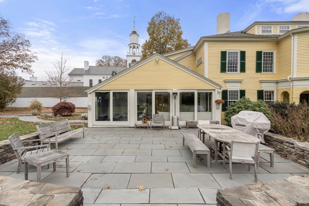 221 Boston Post Road Wayland, MA 01778 - Photo 30 of 37 a view of a house with backyard sitting area and garden
