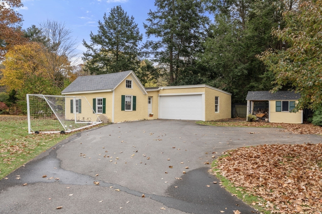 221 Boston Post Road Wayland, MA 01778 - Photo 34 of 37 a view of a house with a backyard and a tree