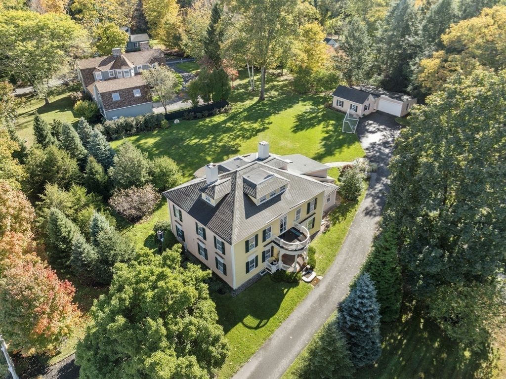 221 Boston Post Road Wayland, MA 01778 - Photo 35 of 37 an aerial view of a house with a yard and large trees
