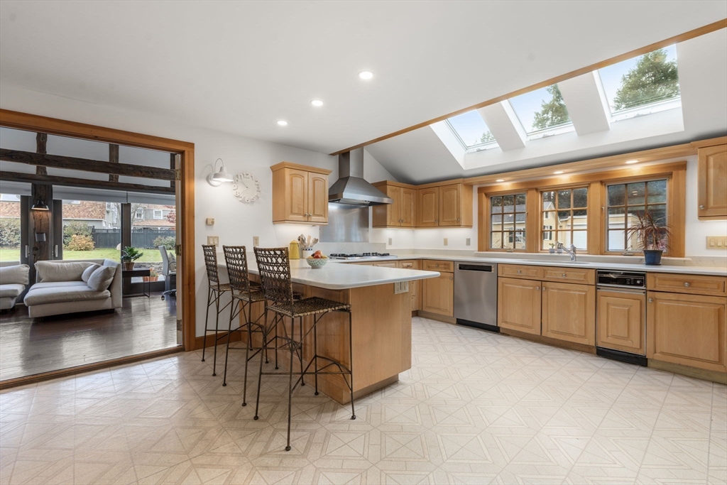 221 Boston Post Road Wayland, MA 01778 - Photo 5 of 37 a kitchen with stainless steel appliances kitchen island granite countertop a sink and cabinets
