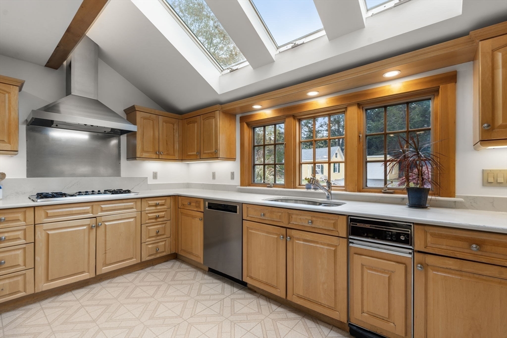221 Boston Post Road Wayland, MA 01778 - Photo 8 of 37 a kitchen with granite countertop stainless steel appliances a sink and cabinets